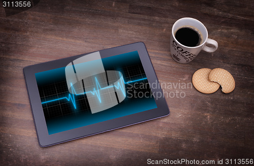 Image of Electrocardiogram on a tablet - Concept of healthcare