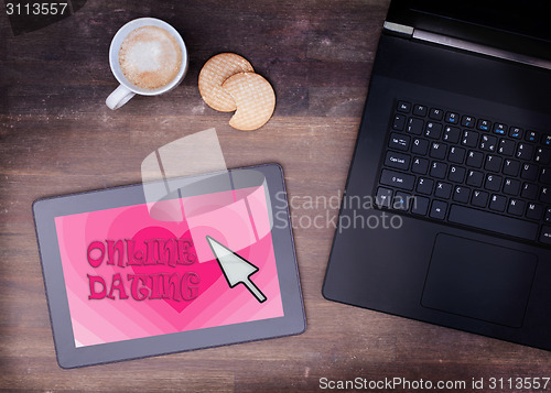 Image of Online dating on a tablet