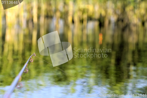 Image of fishing rod river angling with float