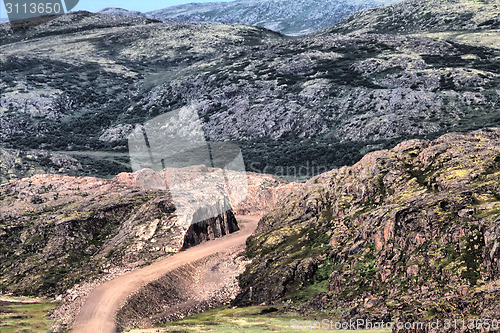 Image of road construction in rocks of mountains