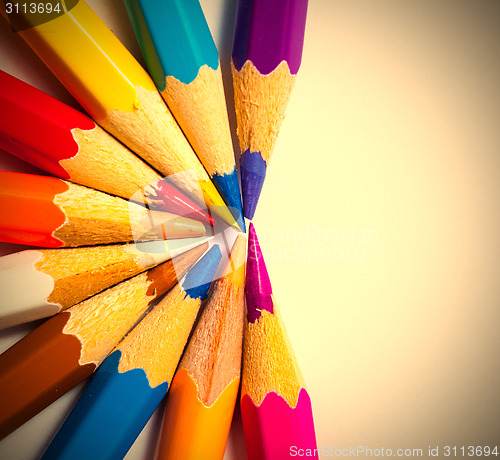 Image of varicolored pencils on white background