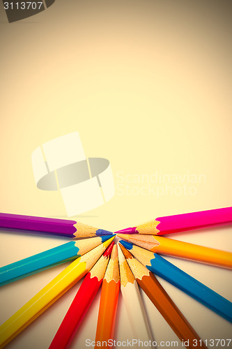 Image of varicolored pencils on white background