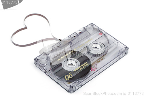 Image of Audio cassette tape on white backgound. Film shaping heart