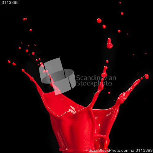 Image of splash of red paint isolated on black