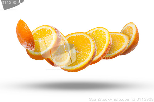 Image of Falling slices of orange in air on white