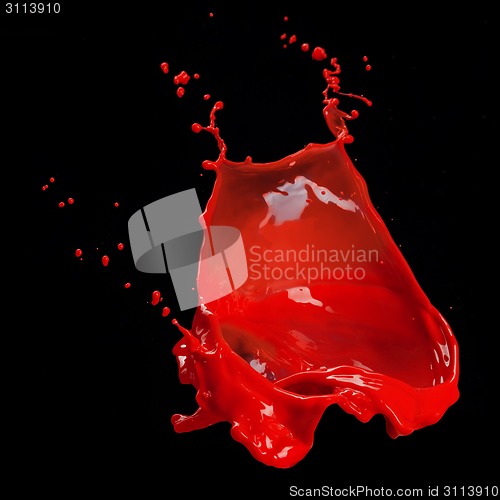 Image of splash of red paint isolated on black