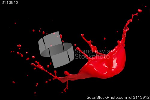 Image of splash of red paint isolated on black