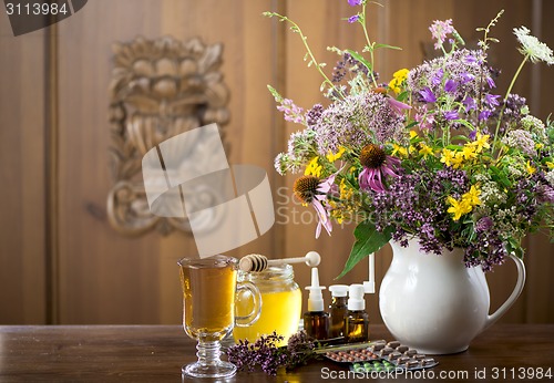 Image of medicinal herbs, honey, herbal tea