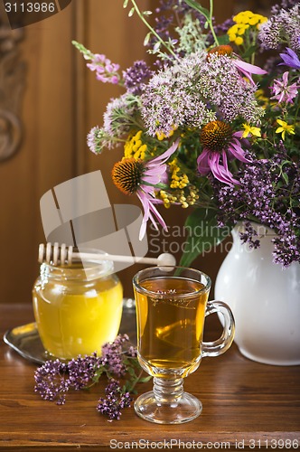 Image of medicinal herbs, honey, herbal tea