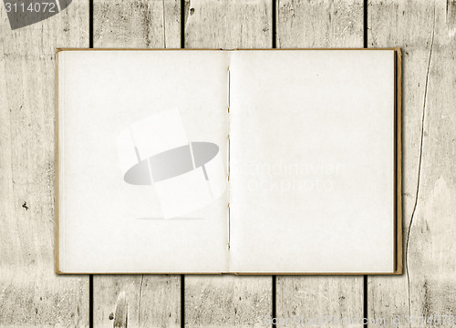 Image of Note book on a white wood background