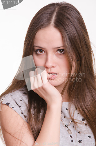 Image of Portrait of beautiful girl with hand near face