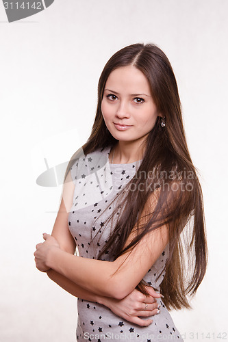 Image of Girl hugging her arms