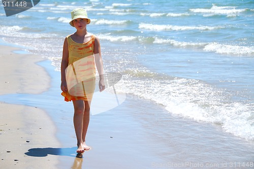 Image of Girl walk beach