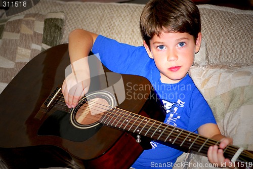 Image of Boy play guitar