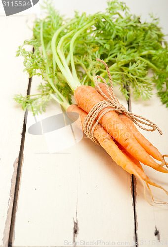 Image of baby carrots bunch tied with rope