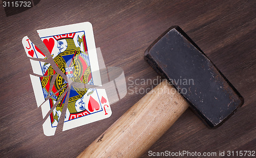 Image of Hammer with a broken card, jack of hearts