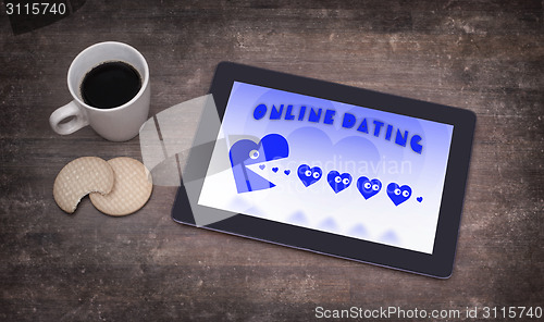 Image of Online dating on a tablet