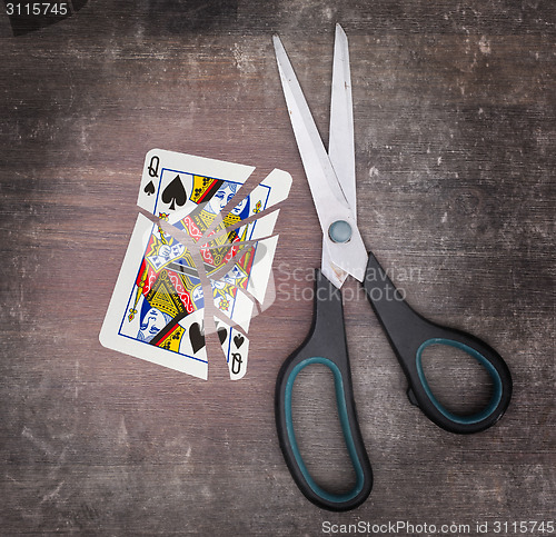 Image of Concept of addiction, card with scissors