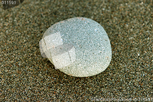 Image of Stone in sand