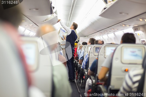 Image of Steward on the airplane.