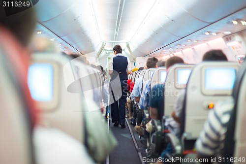 Image of Stewardess on the airplane.