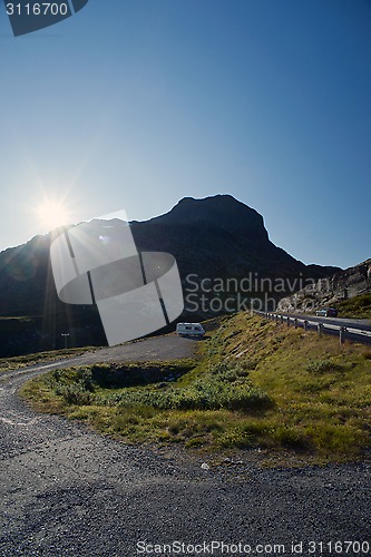 Image of Sun shining on the road through mountain plateau Valdresflye, Jo