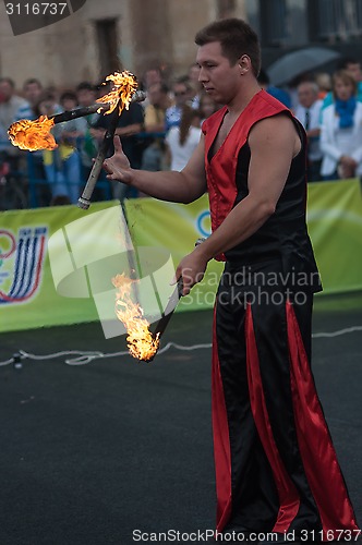 Image of Juggling flaming batons