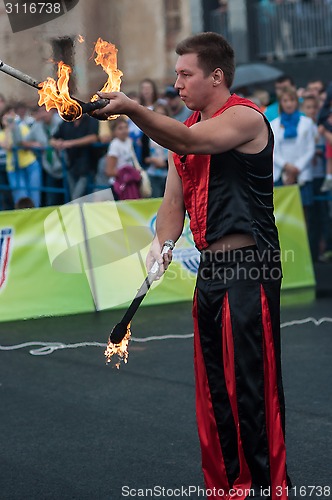 Image of Juggling flaming batons