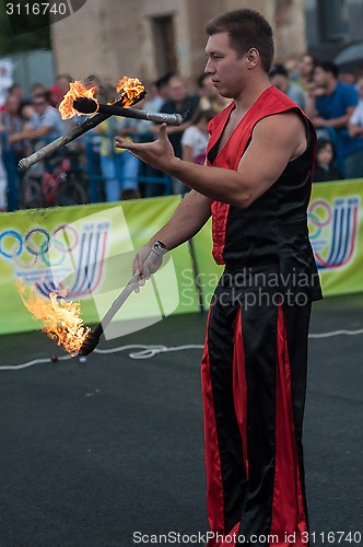 Image of Juggling flaming batons