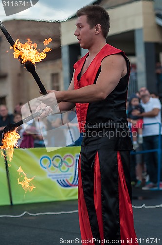 Image of Juggling flaming batons