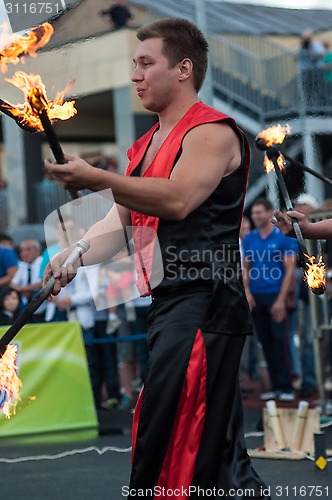 Image of Juggling flaming batons