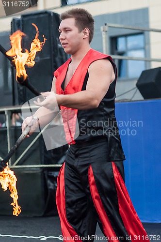 Image of Juggling flaming batons