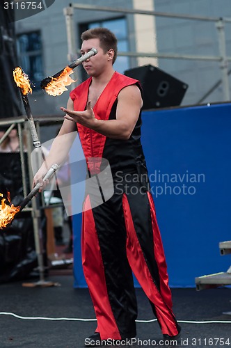 Image of Juggling flaming batons