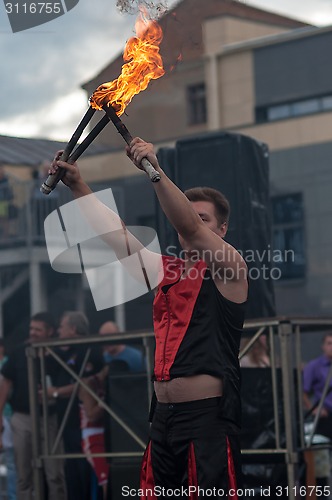 Image of Juggling flaming batons