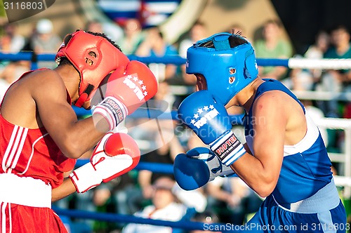Image of A boxing match Javier Ibanez, Cuba and Malik Bajtleuov, Russia. Defeated Javier Ibanez