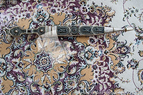 Image of Dagger Damascus Steel on the carpet