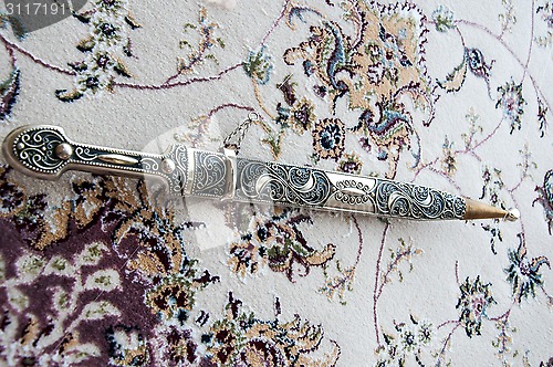 Image of Dagger Damascus Steel on the carpet