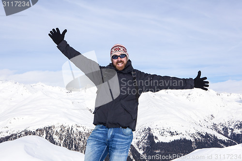 Image of Guy is happy to be in the snowy mountains
