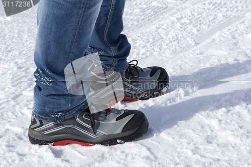 Image of Safety shoes in the snowy mountains