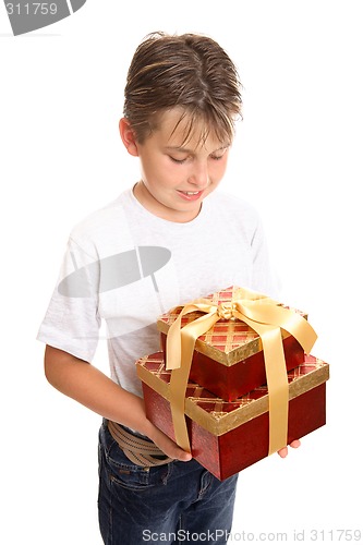 Image of Child holding stack of presents