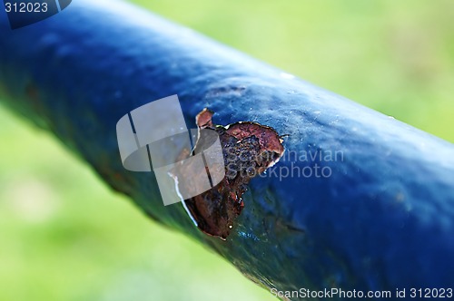 Image of A Rust Spot On A Gate