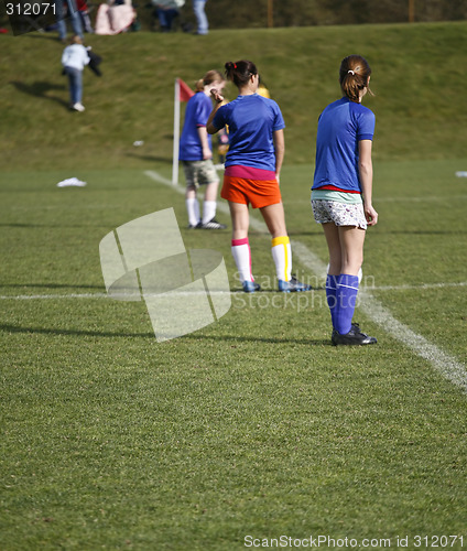 Image of Girls Soccer Team Waits to Kick Off
