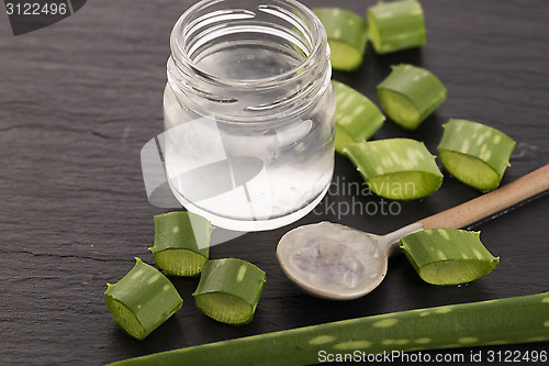 Image of aloe vera juice with fresh leaves 