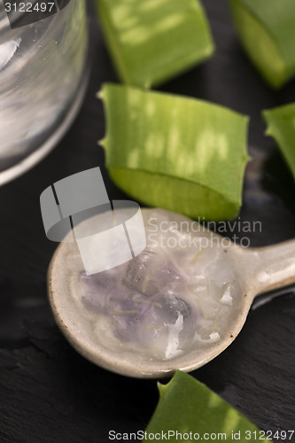 Image of aloe vera juice with fresh leaves 