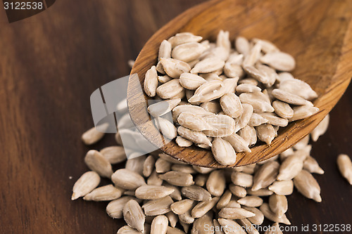 Image of Sunflower seed with a wooden spoon