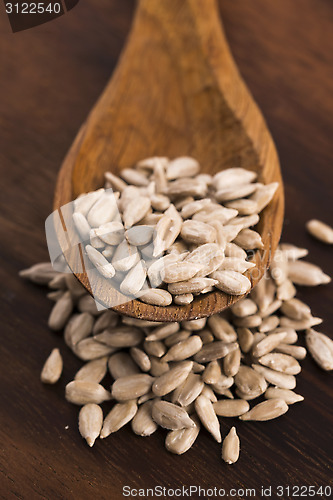 Image of Sunflower seed with a wooden spoon