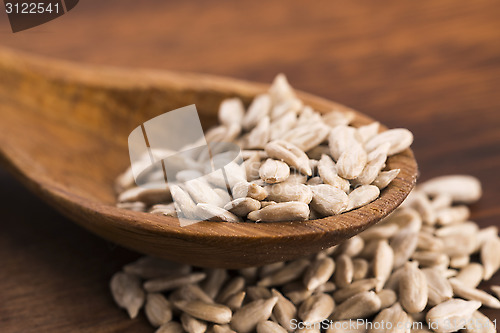Image of Sunflower seed with a wooden spoon