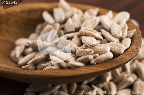 Image of Sunflower seed with a wooden spoon
