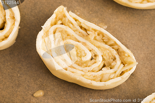 Image of Puff pastry cookies with apple and cinnamon before baking
