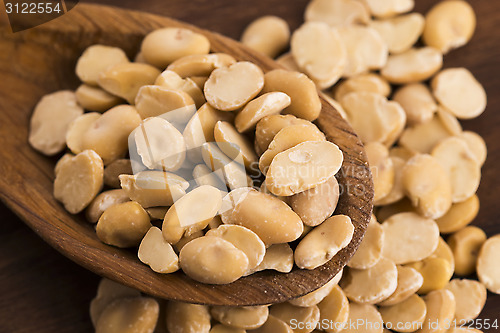 Image of broad bean dry on wooden table